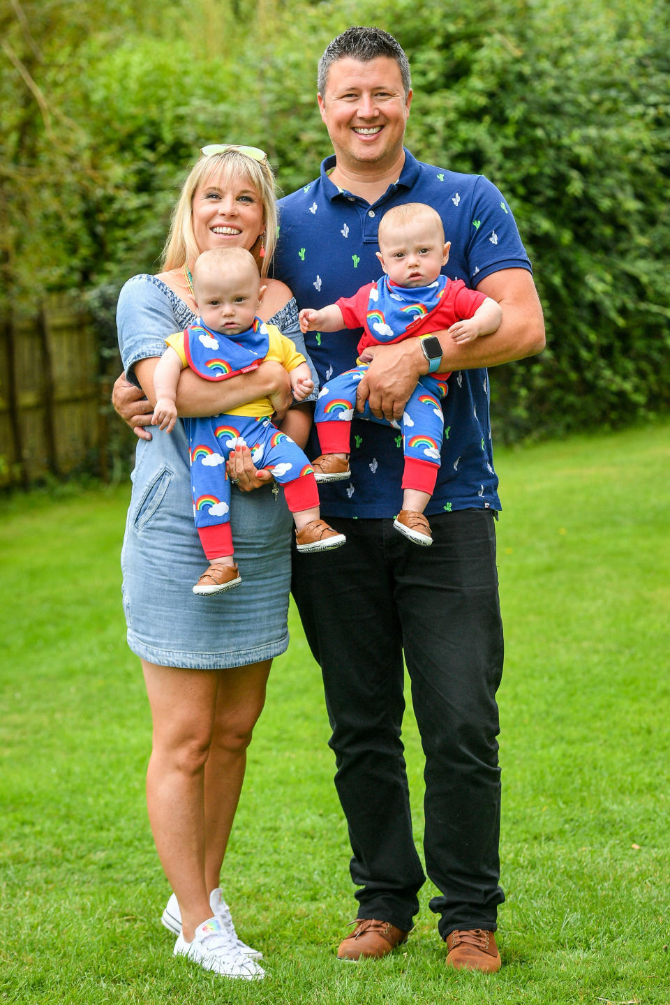 Jennie and Rich Powell with their twin boys Ruben (left) and Jenson, who are celebrating their first birthday by meeting HM Coastguard crews (PA)