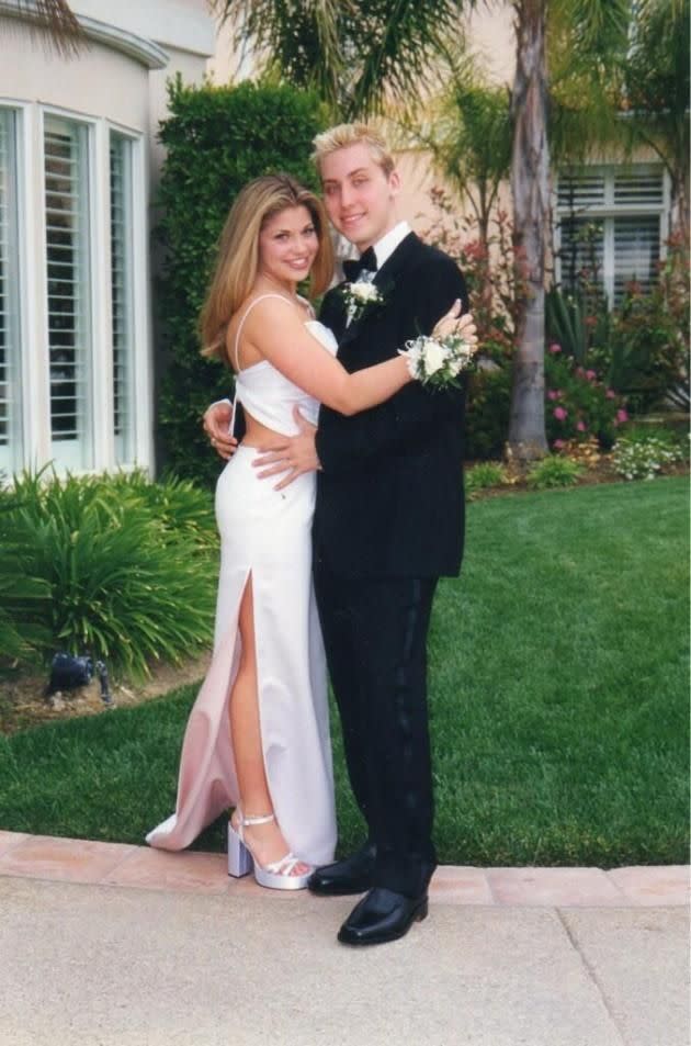 <p>Lance Bass was the dream date of many girls jamming to NSync’s “Tearin’ Up My Heart” in 1999, but it was his girlfriend at the time, Boy Meets World actress Danielle Fishel, who actually snagged him as her prom date. The romantic night almost didn’t happen, though, because Bass had boy band obligations — which, thankfully, were canceled. He ended up sending Fishel “three dozen roses in the mail,” she told <a rel="nofollow noopener" href="http://www.usmagazine.com/celebrity-news/news/danielle-fishel-lance-bass-went-to-prom-together-picture-proof-201354" target="_blank" data-ylk="slk:Us Weekly;elm:context_link;itc:0;sec:content-canvas" class="link ">Us Weekly</a>, “With a card that said, ‘Plans have changed, I’ll be in town. Can I take you to prom? Check yes or no.’” Awww! (Photo: Twitter) </p>