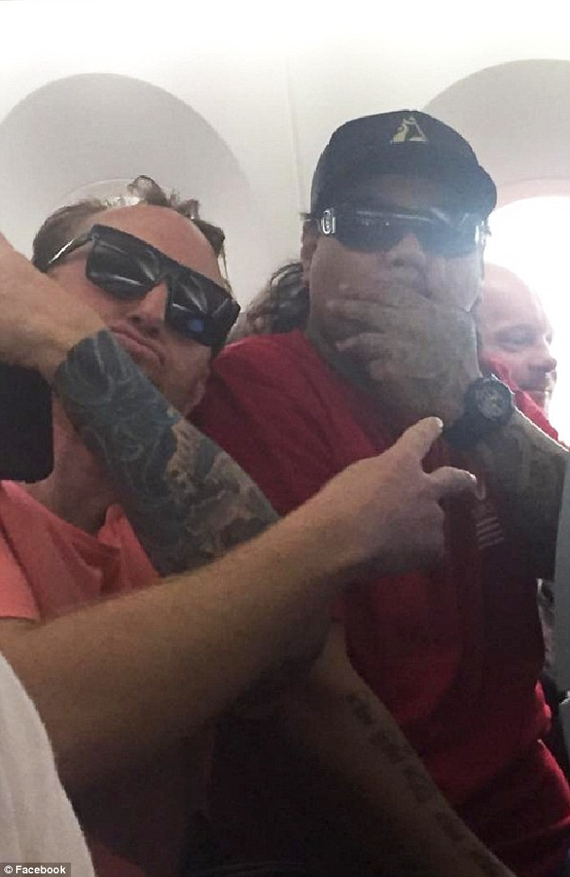 The men, believed to be involved in the brawl, pictured on the plane. Photo: Supplied