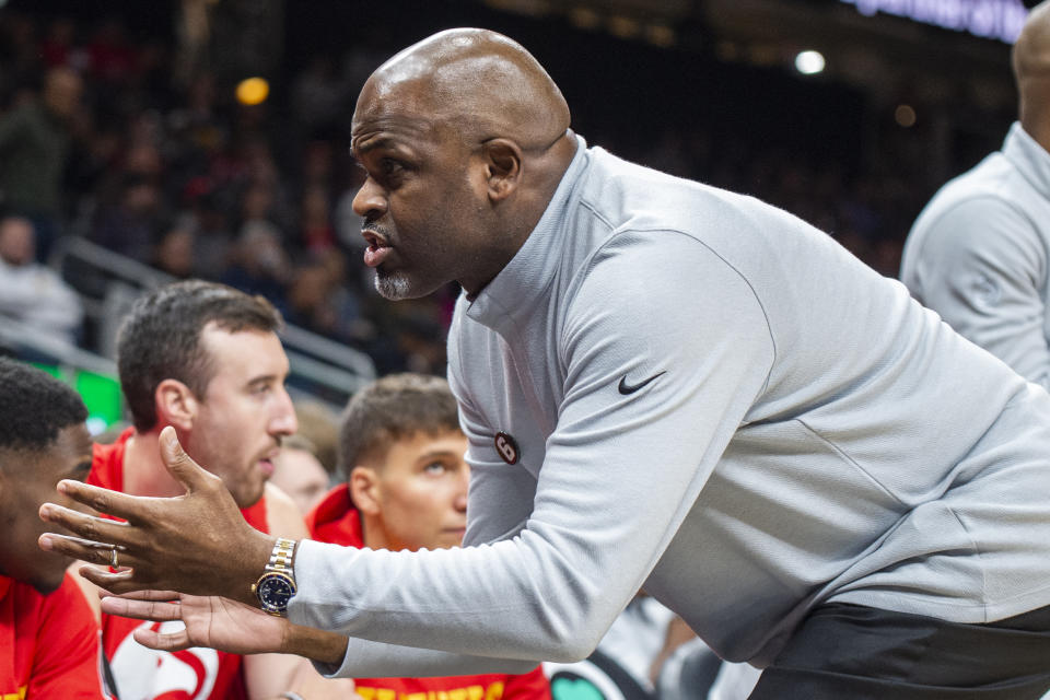 Atlanta Hawks head coach Nate McMillan speaks to players on the bench during the first half of an NBA basketball game against the Oklahoma City Thunder, Monday, Dec. 5, 2022, in Atlanta. (AP Photo/Hakim Wright Sr.)