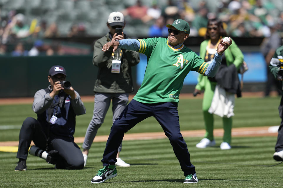 Former Oakland Athletics player Reggie Jackson throws out the ceremonial first pitch after a ceremony honoring the Athletics' 1973 World Series championship team before a baseball game between the Athletics and the New York Mets in Oakland, Calif., Sunday, April 16, 2023. (AP Photo/Jeff Chiu)