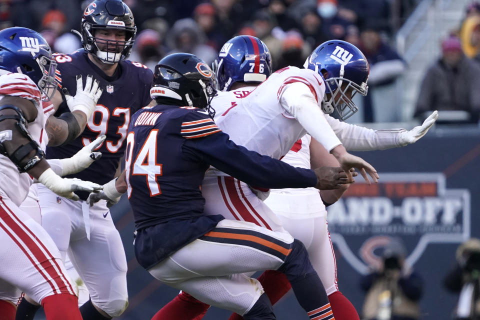 Chicago Bears outside linebacker Robert Quinn (94) strip-sacks New York Giants quarterback Mike Glennon, setting a new team record for sacks in a season, during the second half of an NFL football game Sunday, Jan. 2, 2022, in Chicago. The Bears won 29-3. (AP Photo/David Banks)