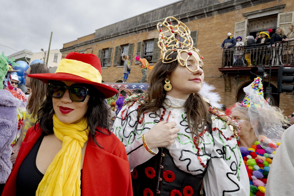 Carmen Sandiego is spotted as people walk in costumes during the Society of Saint Anne parade through Bywater and Marigny neighborhoods on Mardi Gras Day in New Orleans, Tuesday, Feb. 13, 2024. (AP Photo/Matthew Hinton)