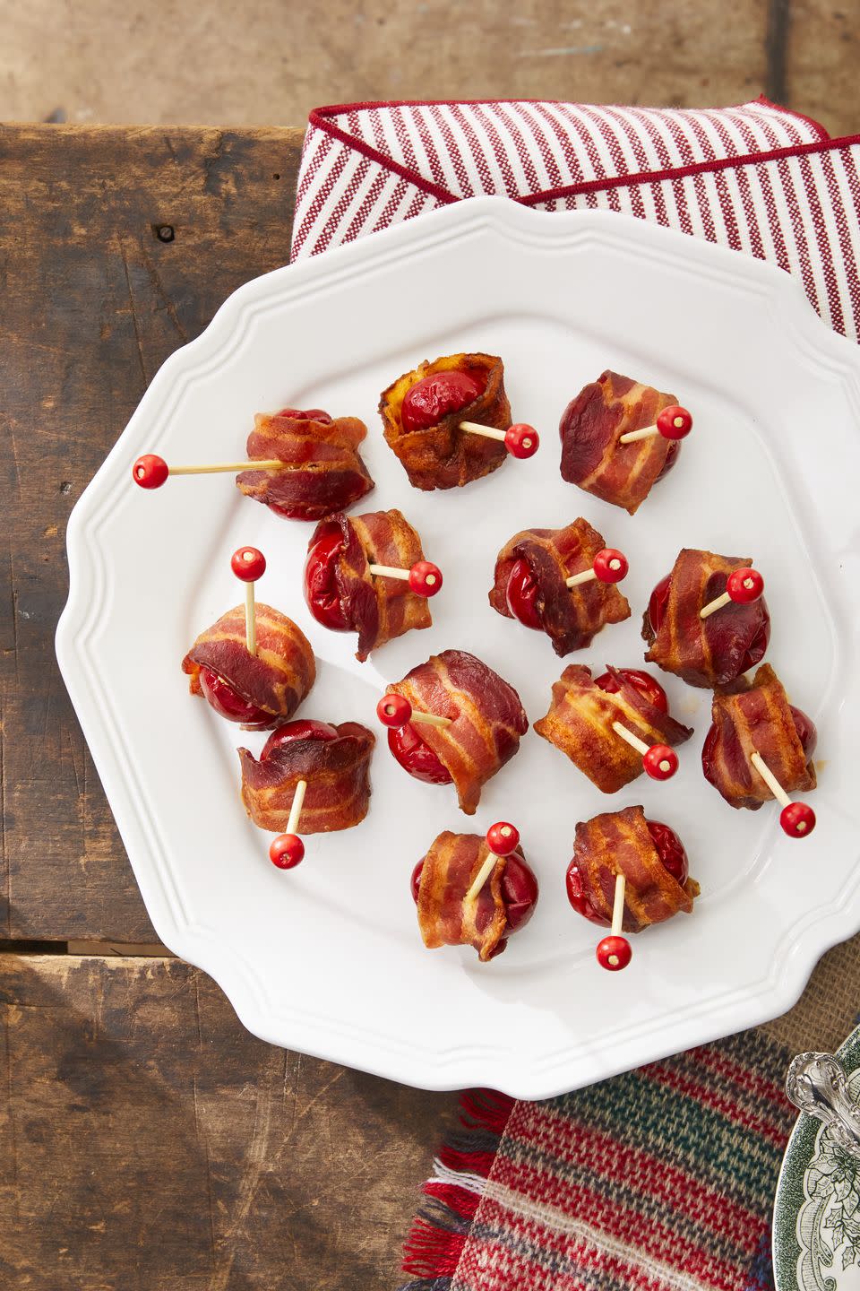 bacon wrapped stuffed peppadews on a plate