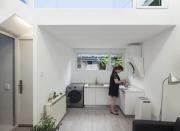 <p>It features a kitchen that connects to a living room, two small bedrooms, and a bathroom. </p>