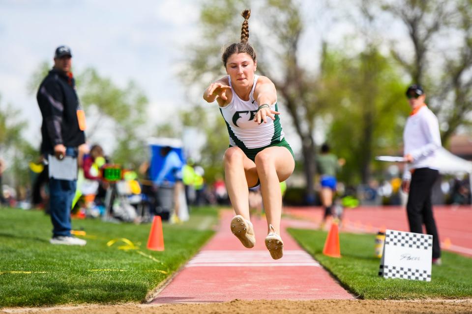 Fossil Ridge's Addison Hayes competes in the Class 5A triple jump at the Colorado high school track and field state meet at Jeffco Stadium on Thursday, May 18, 2023, in Lakewood, Colo.