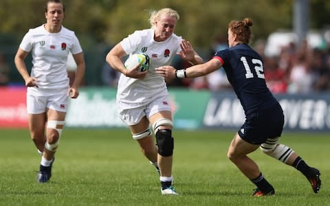 Tamara Taylor (centre) is tackled by Alev Kelter of USA during the Women's Rugby World Cup - Credit: getty images