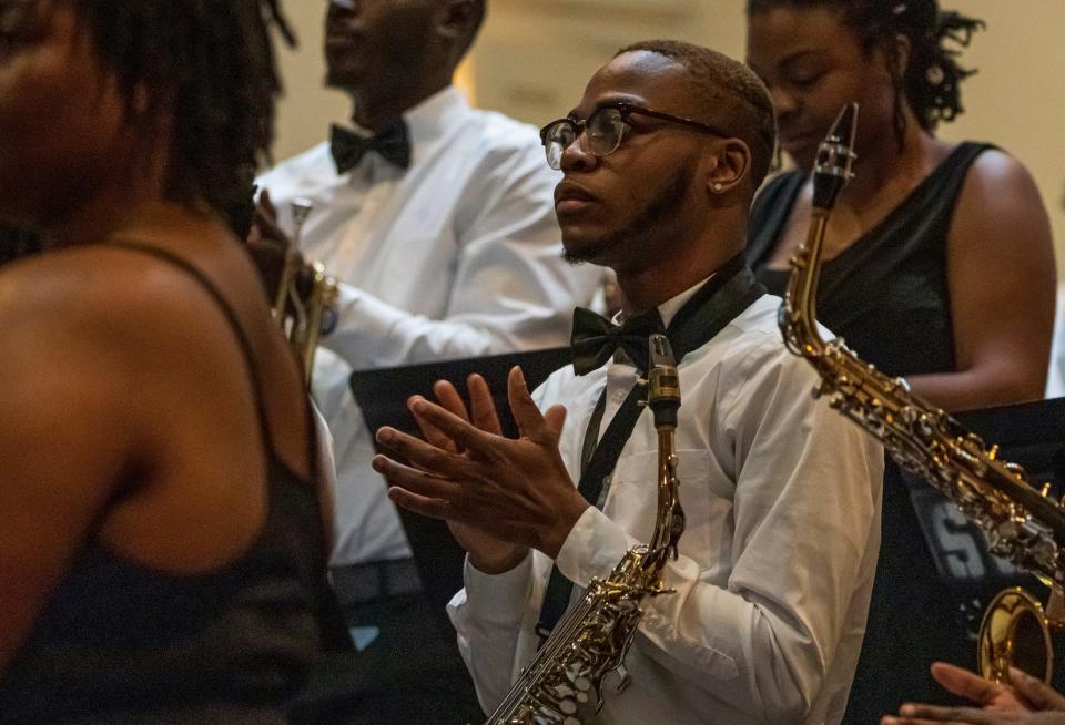 DaJon Stoudemire, a member of Stillman College’s concert band, applauds following a performance during their Spring 2022 concert.