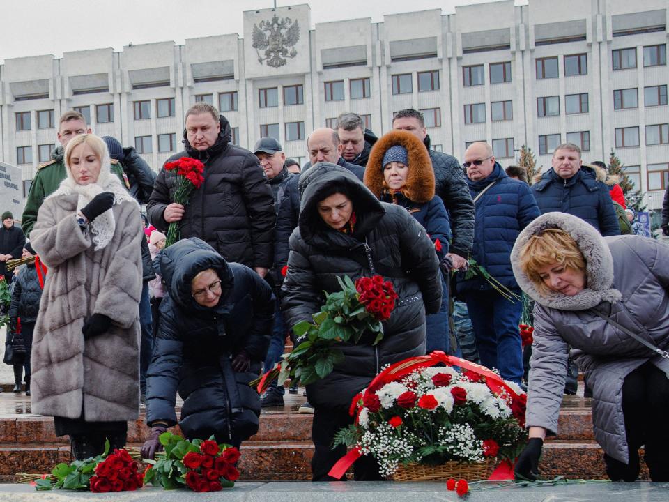 Participants lay flowers in Glory Square in Samara the day after the Kremlin announced 63 Russian troops were lost in one attack (Reuters)