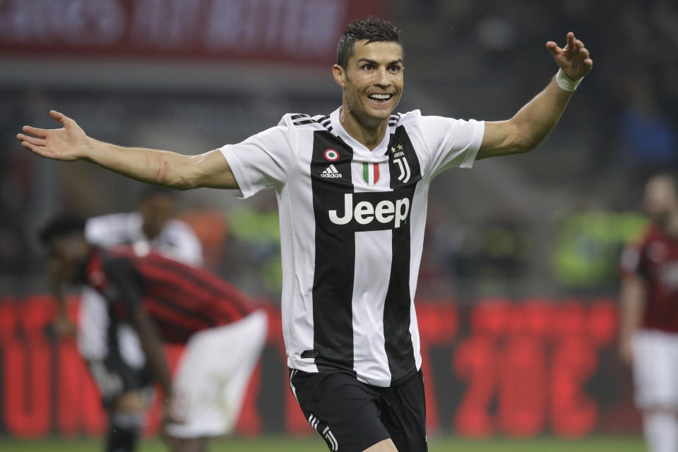 Juventus' Cristiano Ronaldo celebrates after he scored his side's second goal during a Serie A soccer match between AC Milan and Juventus, at Milan's San Siro stadium, Sunday, Nov. 11, 2018. (AP Photo/Luca Bruno)