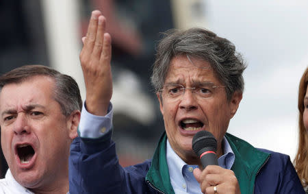 Guillermo Lasso, presidential candidate from the CREO party greets supporters outside the electoral council (CNE) headquarters, in Quito, Ecuador , February 21, 2017. REUTERS/Henry Romero