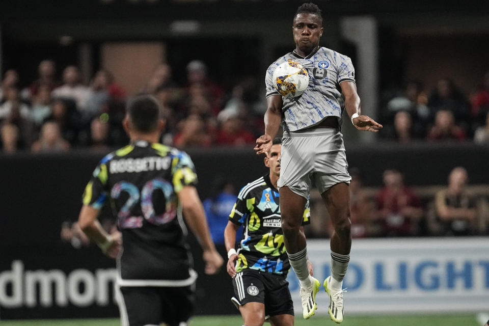 CF Montréal forward Chinonso Offor (9) stops the ball ahead of Atlanta United midfielder Matheus Rossetto (20) during the first half of a MLS soccer match, Saturday, Sept. 23, 2023, in Atlanta. (AP Photo/Mike Stewart)