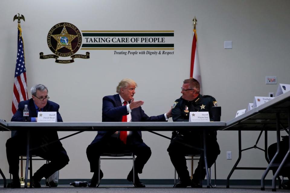 <div class="inline-image__caption"><p>Brevard County Sheriff Wayne Ivey, right, meets with then-nominee Donald Trump in 2016.</p></div> <div class="inline-image__credit">Jonathan Ernst/Reuters</div>