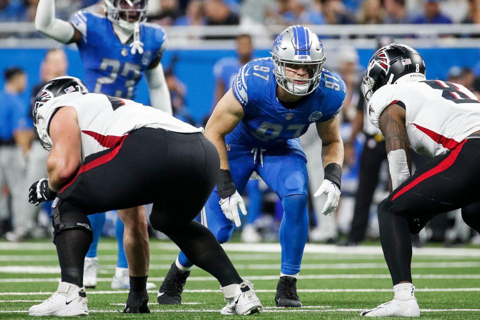 Detroit Lions defensive end Aidan Hutchinson (97) gets into position for a play against Atlanta Falcons during the first half at Ford Field in Detroit on Sunday, Sept. 24, 2023.