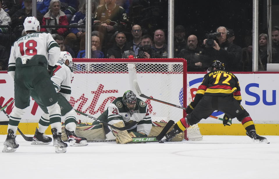 Minnesota Wild goalie Marc-Andre Fleury (29) stops Vancouver Canucks' Anthony Beauvillier (72) during the second period of an NHL hockey game Thursday, March 2, 2023, in Vancouver, British Columbia. (Darryl Dyck/The Canadian Press via AP)