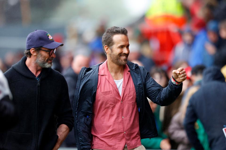 August 5, 2023 : Co-owner of Wrexham Football Club Ryan Reynolds and actor Hugh Jackman meet fans before the Sky Bet League Two match between Wrexham and Milton Keynes Dons at Stok Cae Ras stadium in Wrexham, Wales.
