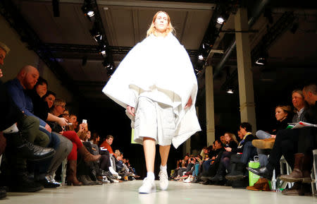 A model presents a creation by students of fashion colleges during the Berlin Fashion Week Autumn/Winter 2019/20 in Berlin, Germany, January 14, 2019. REUTERS/Fabrizio Bensch