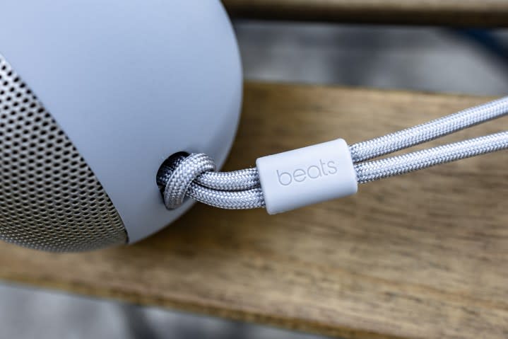 The Beats logo on the lanyard attached to the Beats Pill speaker.