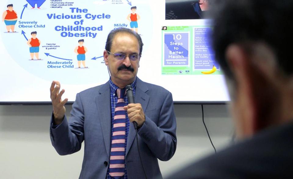 Dr. Bantwal Baliga, an endocrinologist, speaks during the grand opening of the Chattahoochee Institute for Wellness, Longevity and Weight Management in Columbus, Georgia. Baliga, his wife, Dr. Prathibha Baliga who specializes in family medicine, and Dr. Mallika Thiruppathi have partnered to open the practice.