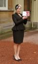 <p>Kate Winslet oozed British class and aristocracy in a feathered fascinator and black peplum suit jacket after receiving her OBE from the Queen at Buckingham Palace.</p>