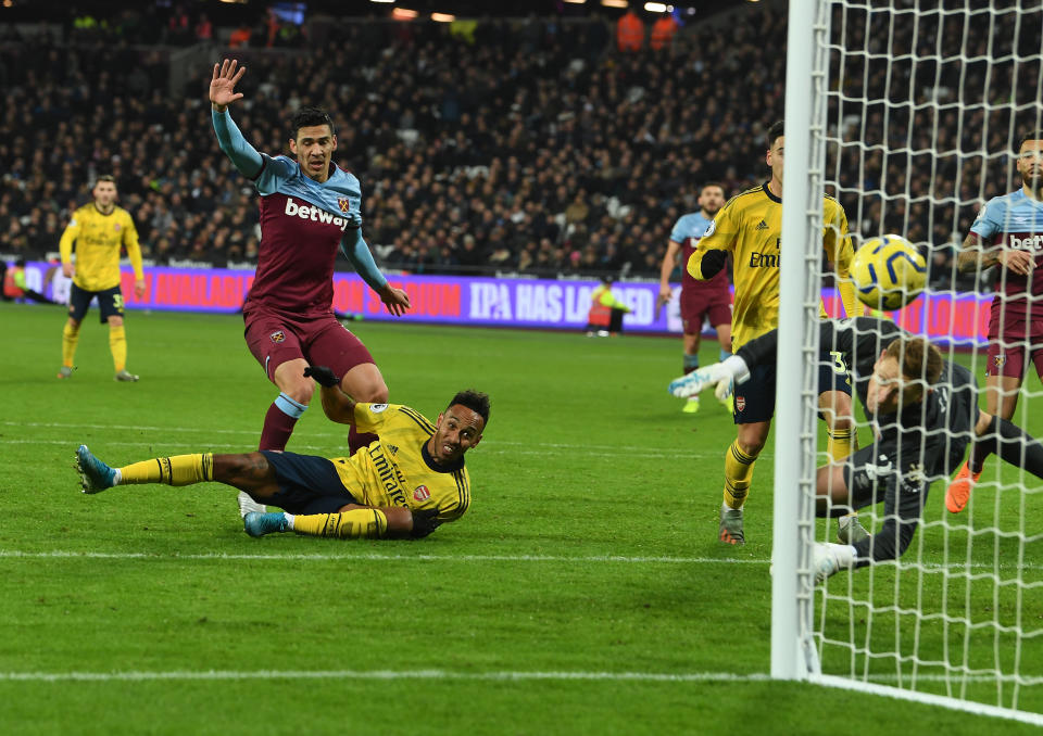 LONDON, ENGLAND - DECEMBER 09: Pierre-Emerick Aubameyang scores the 3rd Arsenal goal during the Premier League match between West Ham United and Arsenal FC at London Stadium on December 09, 2019 in London, United Kingdom. (Photo by Stuart MacFarlane/Arsenal FC via Getty Images)