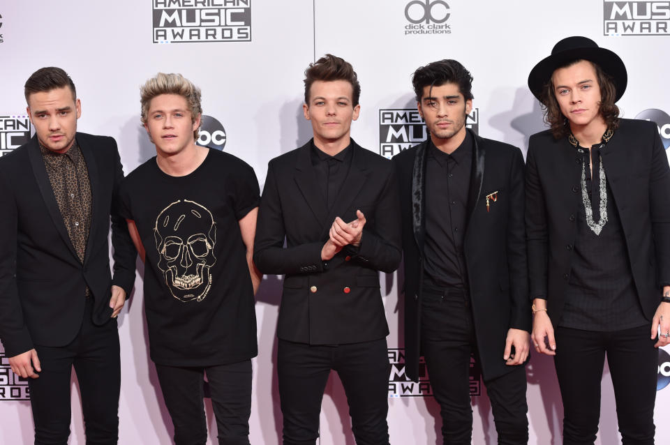 FILE- In this Nov. 23, 2014, file photo, Liam Payne, from left, Niall Horan, Louis Tomlinson, Zayn Malik and Harry Styles of boyband One Direction arrive at the 42nd annual American Music Awards in Los Angeles.Malik said Wednesday, March 25, 2015, he is leaving chart-topping boy band One Direction "to be a normal 22-year-old." His bandmates said they were sad to see him go "but we totally respect his decision and send him all our love for the future." (Photo by John Shearer/Invision/AP, file)