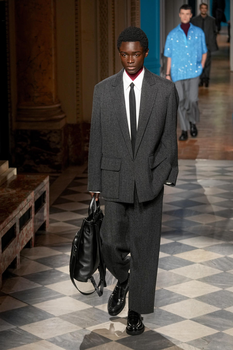 A model wears a creation for Valentino as part of the Menswear ready-to-wear Fall-Winter 2024-2025 collection presented in Paris, Saturday, Jan. 20, 2024. (AP Photo/Michel Euler)