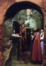 <p>Metropolitan Mar Sewerios Malki Murad, left, the top Syrian Orthodox cleric in the Holy Land, conducts a Sunday service in the Church of the Holy Sepulcher in Jerusalem, Jan. 30, 2000. (Photo: Jacqueline Larma/AP) </p>