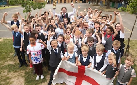 Pupils and staff at Minster Church of England Primary School in Ramsgate wear waistcoats in honour of Gareth Southgate - Credit: PA