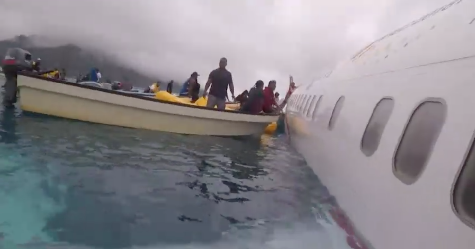 Air Niugini passengers were loaded onto rescue boats. Source: AP