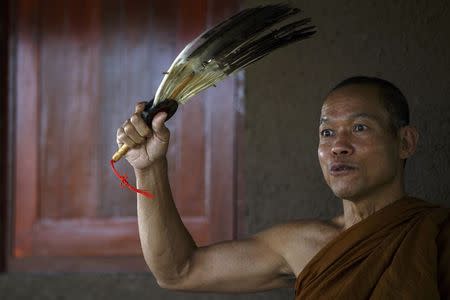 Phra Buddha Issara reacts during an interview with Reuters at Wat Or Noi in Nakhon Pathom February 27, 2015. REUTERS/Athit Perawongmetha