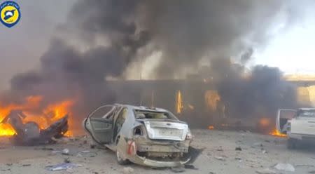 A still image taken from a video uploaded by White Helmets on June 24, 2017, shows vehicles on fire at the site of a car bomb, said to be in the town of al-Dana, in Syria's rebel-held Idlib province. White Helmets via Reuters TV