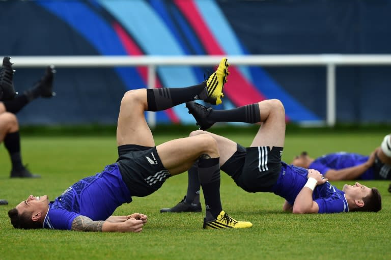 New Zealand All Blacks centre Sonny Bill Williams (L) and New Zealand All Blacks fly-half Beauden Barrett take part in a team training session in Sunbury-on-Thames, west of London, on October 22, 2015