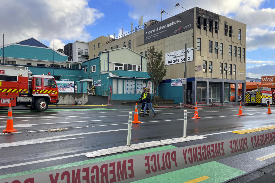 Firefighters work near a hostel in central Wellington, New Zealand, Tuesday, May 16, 2023. Several people were killed after a fire broke out overnight at the four-story building. (Ben McKay/AAP Image via AP)