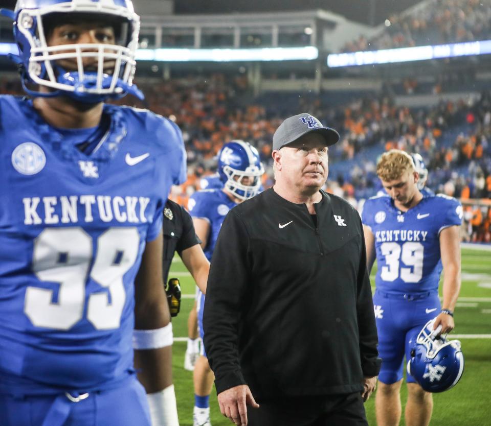 Kentucky coach Mark Stoops walks off the field after the Cats lost, 33-27, to Tennessee on Saturday night in Lexington.