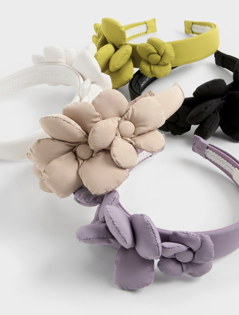 Take your pick from the Flower-Embellished Hair Band that comes in 5 colourways. PHOTO: Charles & Keith