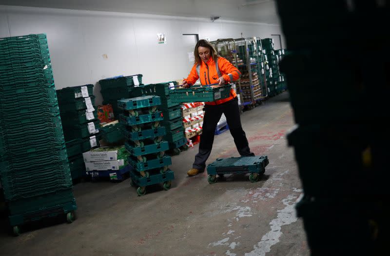 FareShare Development Manager Rachel Ledwith sorts food and checks quality at the FareShare food redistribution centre in Deptford, as the spread of the coronavirus disease (COVID-19) continues, in south east London