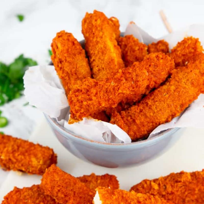 <p>Vegan Heaven</p><p>These vegan baked tofu sticks are the perfect comfort food! They’re crispy, spicy, and super easy to make! We like them best with homemade vegan ranch sauce.</p><p><strong>Get the recipe: <a href="https://veganheaven.org/all-recipes/baked-tofu-sticks/" rel="nofollow noopener" target="_blank" data-ylk="slk:Baked Tofu Sticks;elm:context_link;itc:0;sec:content-canvas" class="link "><em>Baked Tofu Sticks</em></a></strong></p>