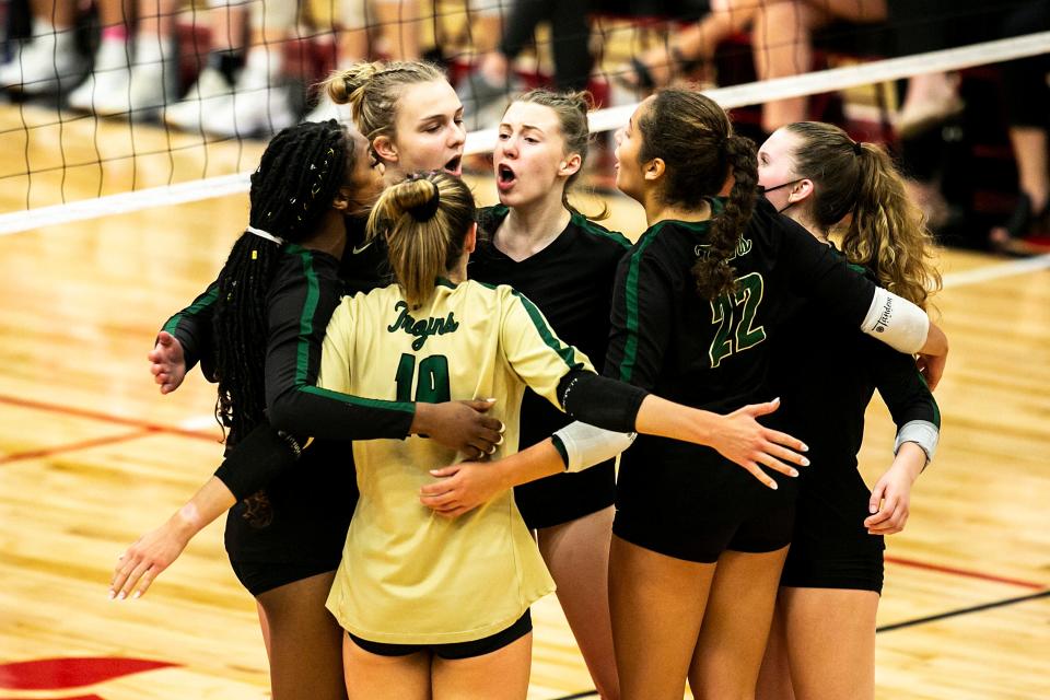 Iowa City West players celebrate a point during a Class 5A varsity volleyball match in the Battle for the Spike against Iowa City High, Thursday, Sept. 30, 2021, at City High School in Iowa City, Iowa.