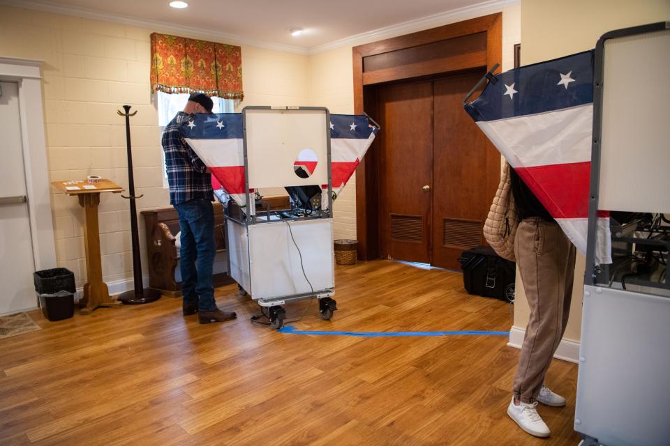 Nick Autry casts his votes at Bellevue Church of Christ on Super Tuesday for the 2024 United States primary elections in Nashville, Tenn., Tuesday, March 5, 2024. Nicole Autry casts her votes in the booth across from his.