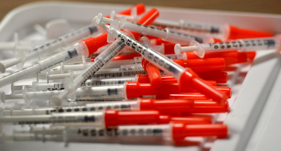 Syringes are gathered for a vaccine clinic for staff at a Cape long-term care facility in August. Cold weather, seasonal holidays, an uptick in cases and the emergence of the omicron variant have led to a run on COVID-19 vaccines on the Cape.