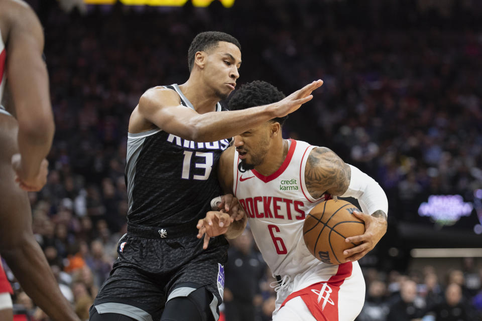 Sacramento Kings forward Keegan Murray (13) defends against Houston Rockets forward Kenyon Martin Jr. (6) during the first quarter of an NBA basketball game in Sacramento, Calif., Friday, Jan. 13, 2023. (AP Photo/José Luis Villegas)