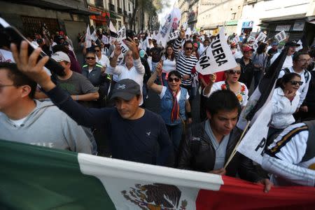 Protesters march during a demonstration against the rising prices of gasoline enforced by the Mexican government in downtown Mexico City, Mexico, January 7, 2017. REUTERS/Edgard Garrido