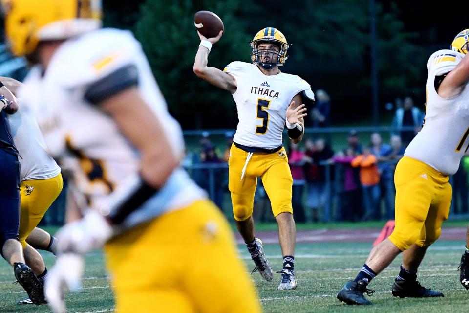 Ithaca's Brady Hessbrook throws a pass during the first quarter on Friday, Aug. 24, 2018, at Alma College.