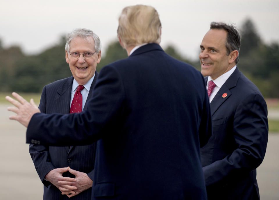 Sen. Mitch McConnell (left) and Bevin greet President Donald Trump in Lexington on Oct. 13, 2018, ahead of a rally nearby. (Photo: ASSOCIATED PRESS/Andrew Harnik)