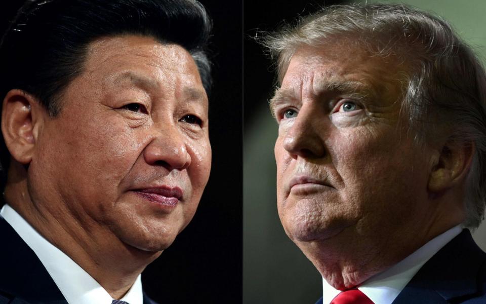 Portraits of China's President Xi Jinping (L) and US President Donald Trump - AFP