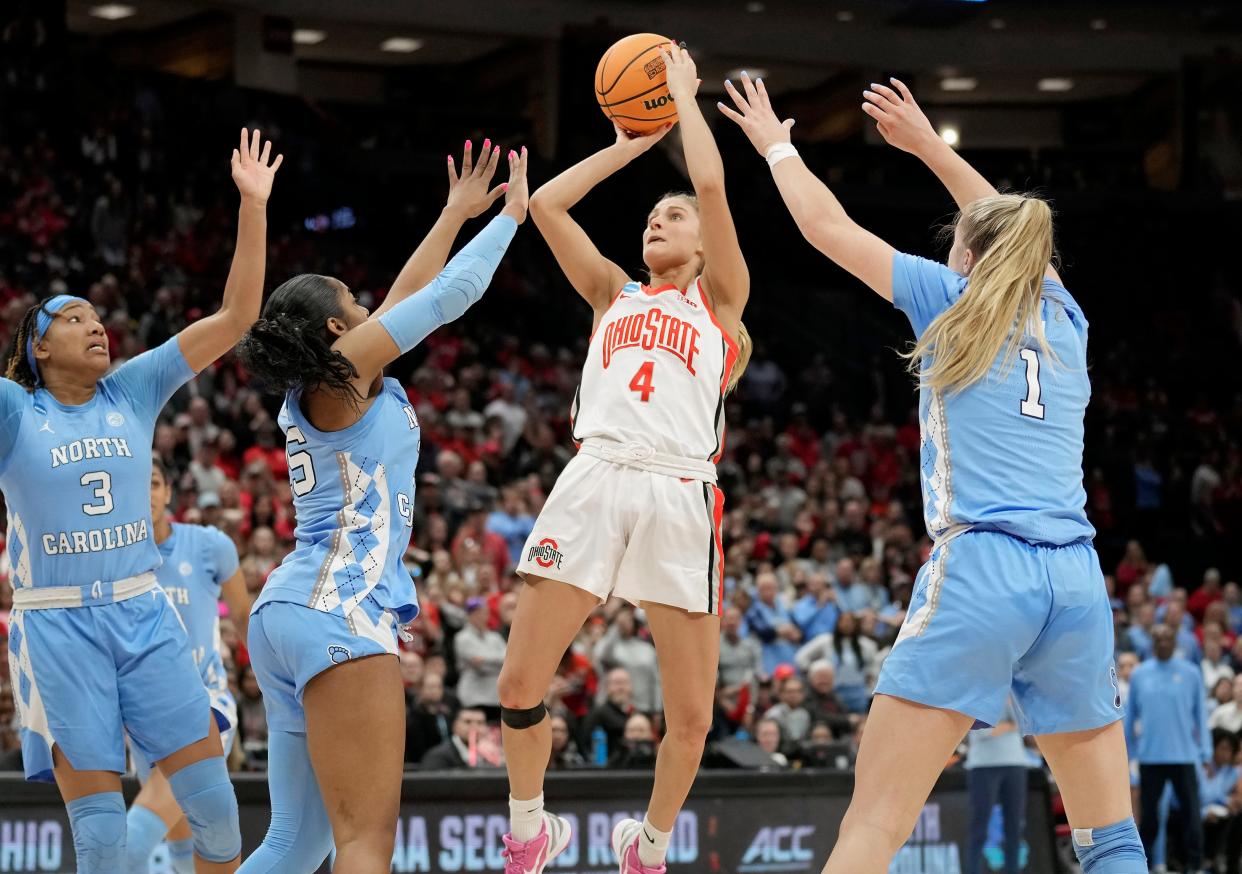 Mar 20, 2023; Columbus, OH, USA; Ohio State Buckeyes guard Jacy Sheldon (4) makes the game winning shot against North Carolina Tar Heels guard Deja Kelly (25) during the fourth quarter of the NCAA second round game at Value City Arena. 