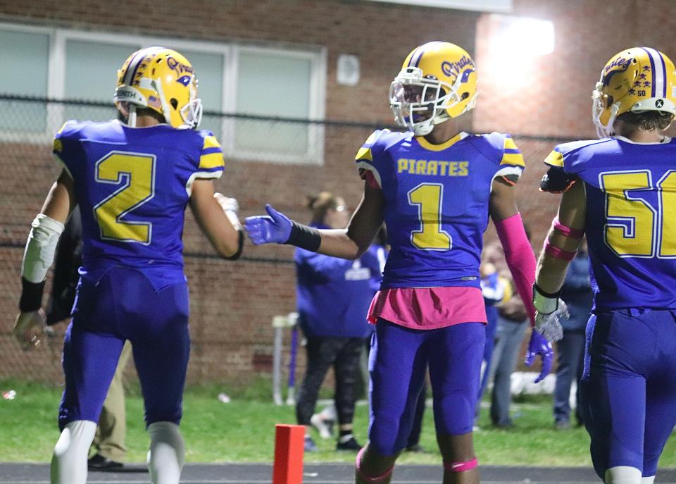 Hull's Austin Bongo (1) celebrates with Jaden Stilphen (2) after Stilphen's rushing touchdown in a win against Randolph at Hull High School on Friday, Oct. 1, 2021.