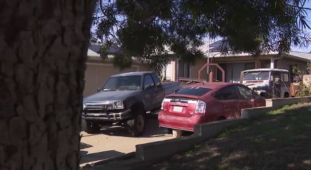 Cars in the driveway of the home were Mary Margaret Haxby-Jones was found dead. (FOX 5)