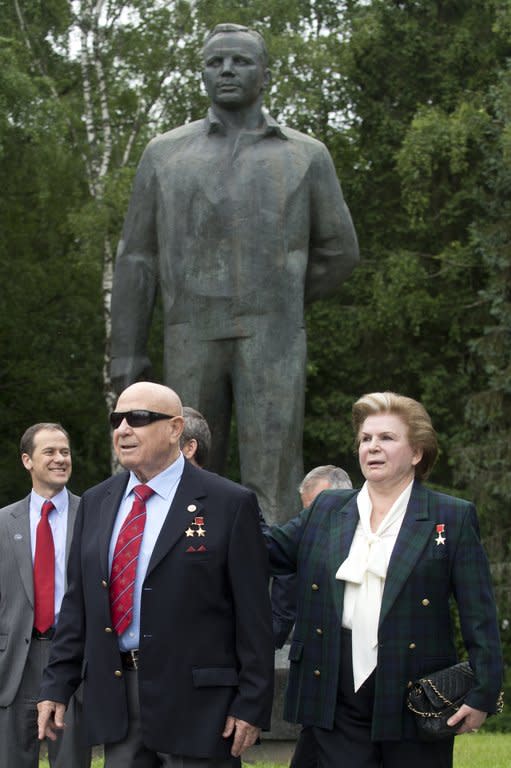 Soviet cosmonauts, the first woman in space, Valentina Tereshkova, and the first man to make a space walk, Alexei Leonov, walk past a monument to Yuri Gagarin, the first man in space, in Star City outside Moscow, on June 7, 2013